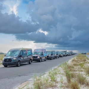 company vans lined up for sunset picture